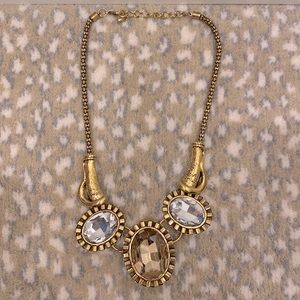 Brass/bronze color necklace, with 3 large gems/rhinestones.